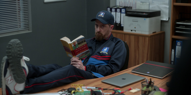 New Balance 515 Sneakers and Apple MacBook Laptop of Brendan Hunt as Coach Beard in Ted Lasso S03E01 “Smells Like Mean Spirit” (2023)